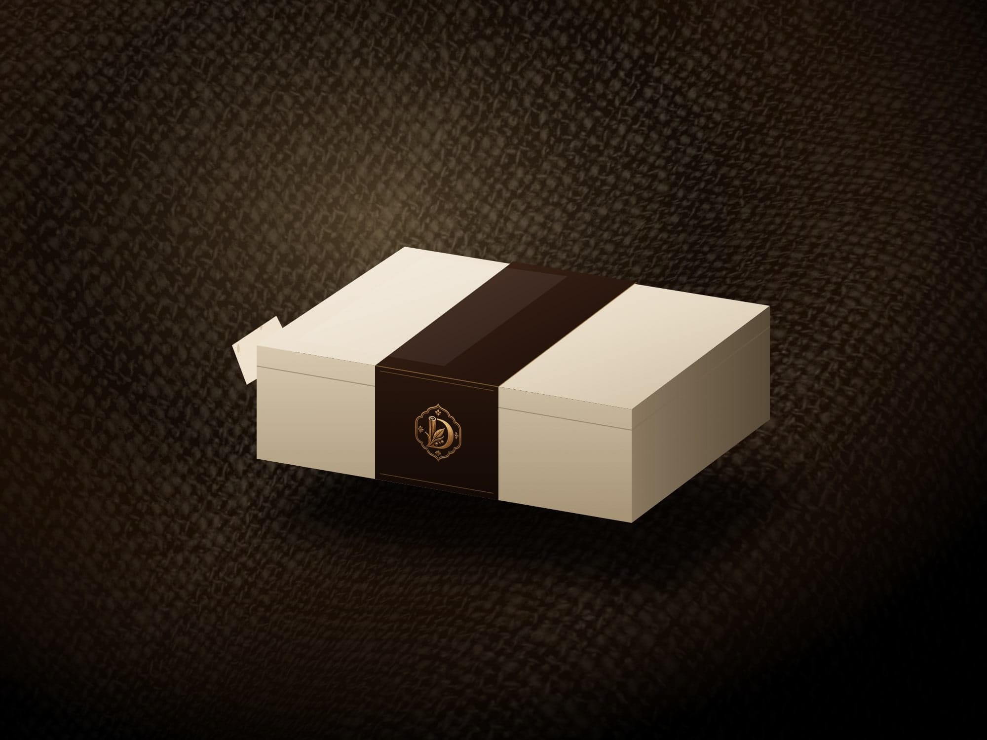 A packaging concept: an ivory box with an espresso sleeve, stamped in brass with the DAALCHEENI emblem, on dark linen