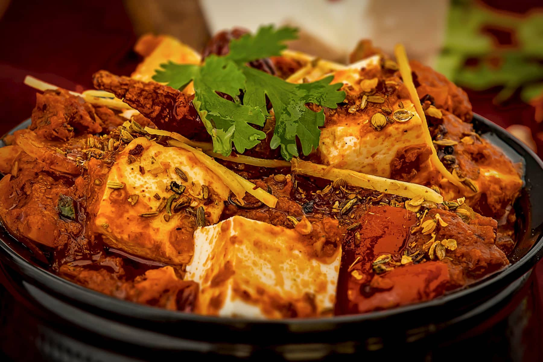 Paneer Nihari: paneer in a deep mahogany gravy, finished with ginger julienne and coriander